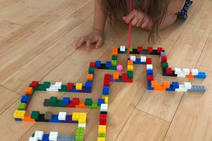 Blow Pom Poms Through a LEGO Maze Activity