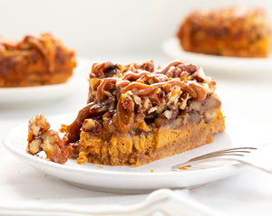 Dulce de Leche Pecan Pie is a dulce de leche cheesecake layered with toasted pecans and a pecan pie filling, all topped and baked with more pecan