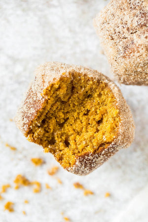 Donut Pumpkin Muffins: moist spiced pumpkin muffins are baked, coated in butter and tossed in cinnamon sugar for that perfect sweet outside – just like a donut!