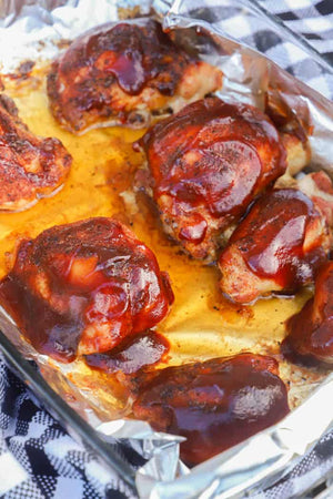 These Baked BBQ Chicken Thighs are made with a homemade rub and then baked and smothered in bbq sauce